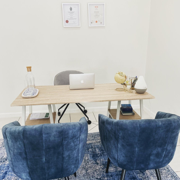 Bright and welcoming chiropractic consultation room at Bump & Beyond Clinic in Wimbledon